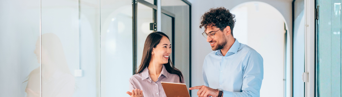 Shot of a two confident business persons talking in the work place