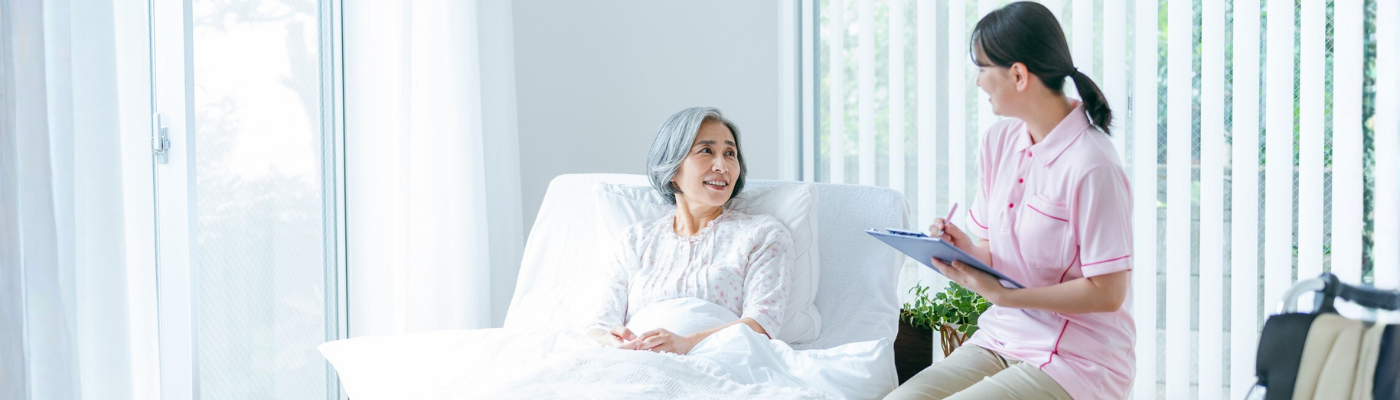 Senior woman and young caregiver