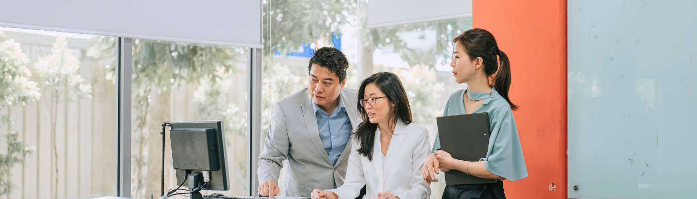 3 Asians discussion inside classroom 