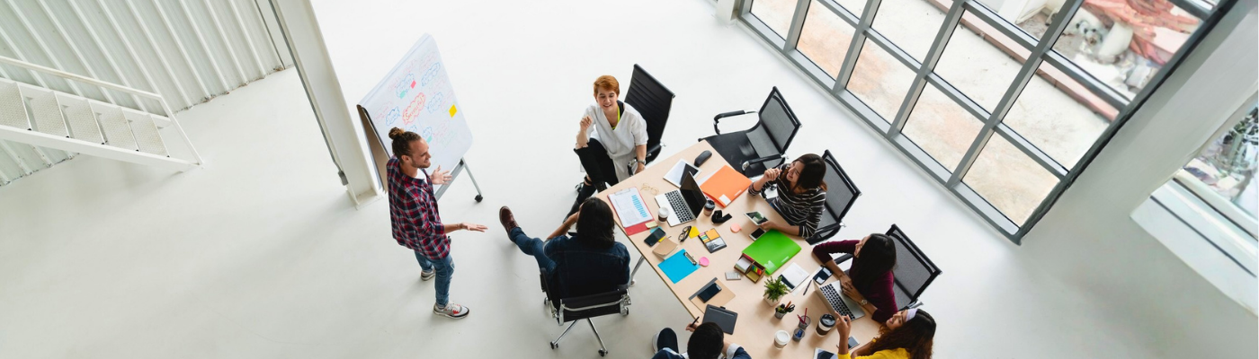 Overhead view of Asian young employees in a meeting