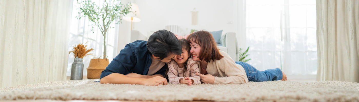 A family spends time together on the floor at home