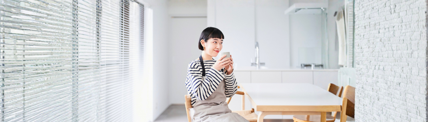 A young woman with an apron resting in the room