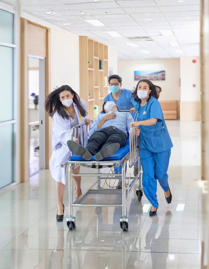 Team of doctors and surgeon rushing patient