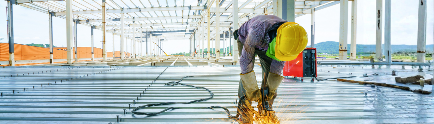 Welder with re-bar shear keys metal deck slab of mezzanine floor
