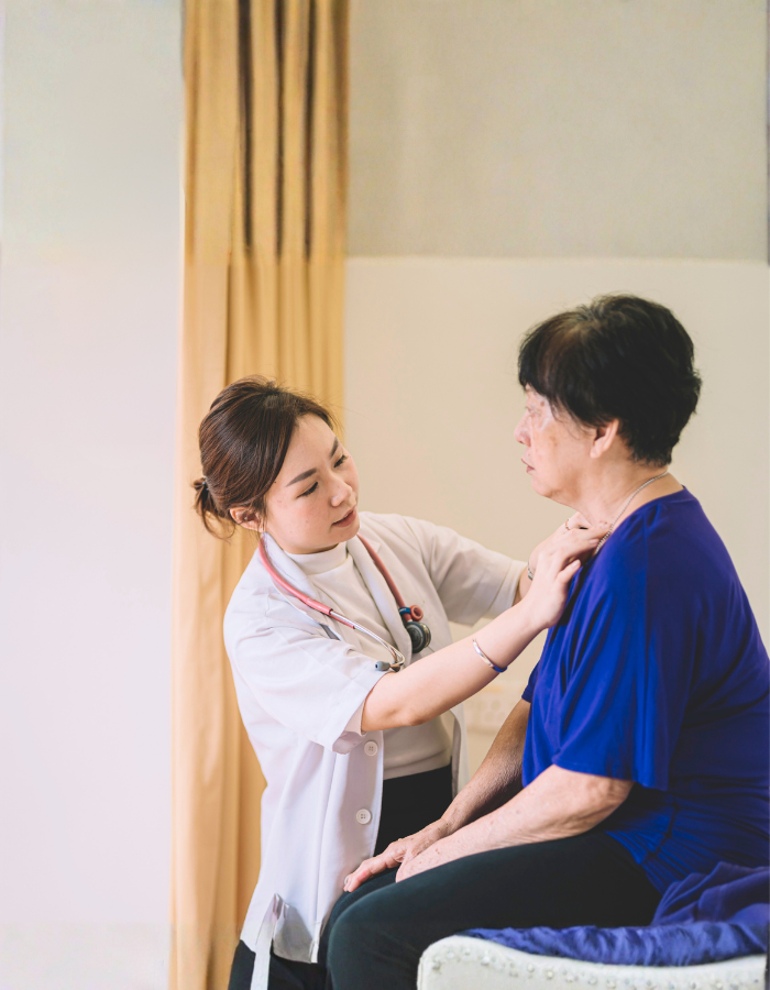 An asian chinese female doctor examining an asian chinese senior woman